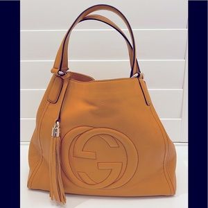 Gucci Soho large orange leather shoulder bag.